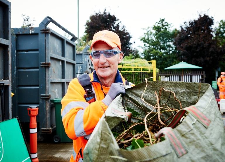 Ioannis carrying green waste at Kings Road Recycling Centre 